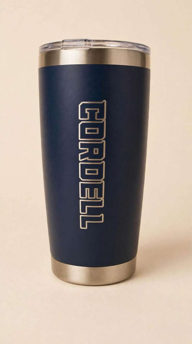Navy tumbler laser-etched with the name Cordell