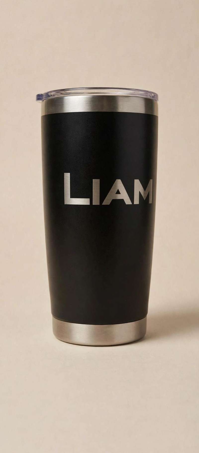 Black tumbler laser-etched with the name Liam on a display stand