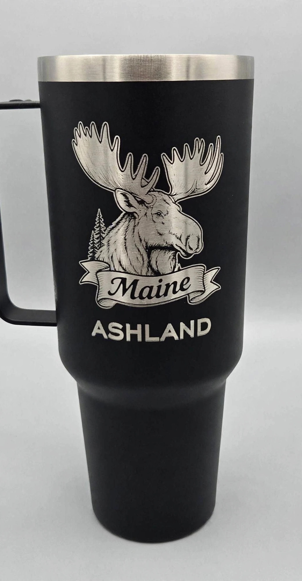 Black 30oz tumbler laser-etched with a moose, Maine banner, and ASHLAND text