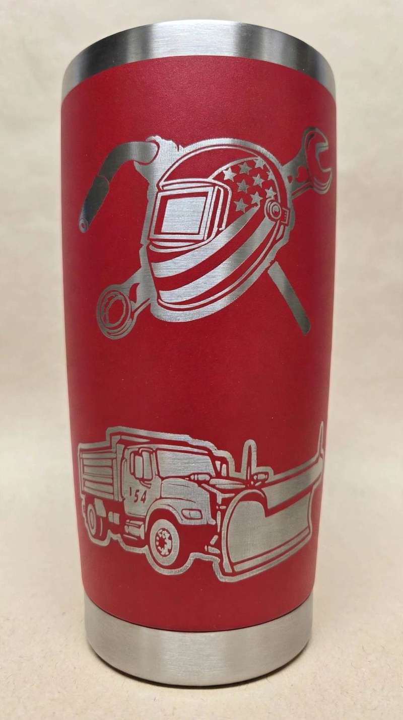 Red tumbler laser-etched with a welding helmet and snow plow truck